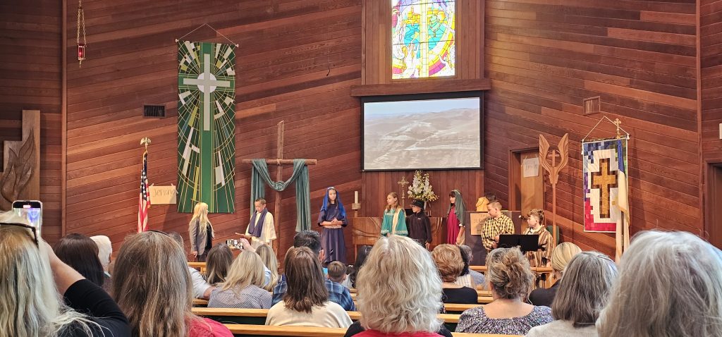 Students dressed in historical attire act out the story of The Good Samaritan at the front of church during St. Paul's Sunday Kids Takeover Service on Oct. 19.